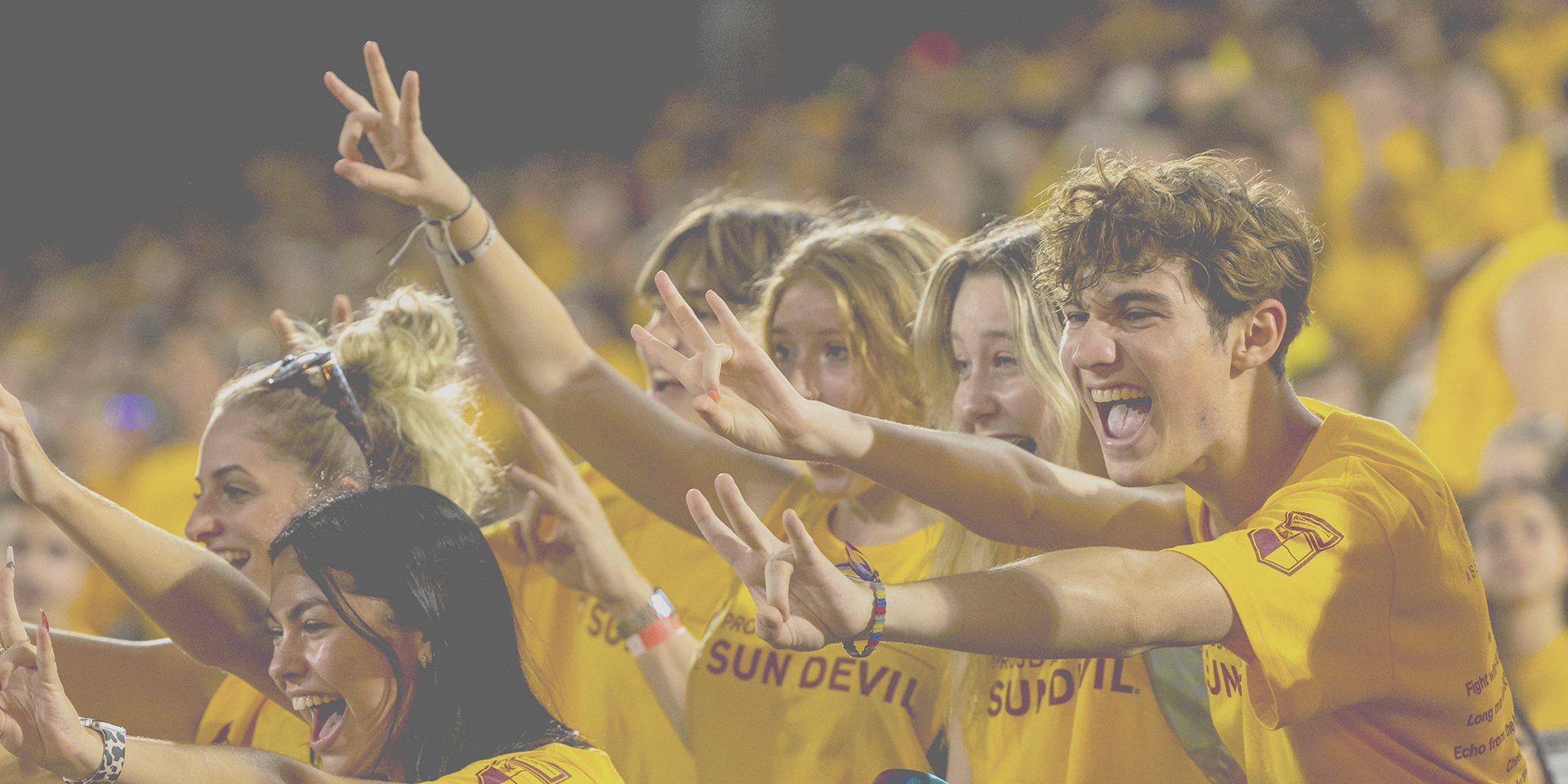 ASU fans at a game, cheering on the Sun Devils